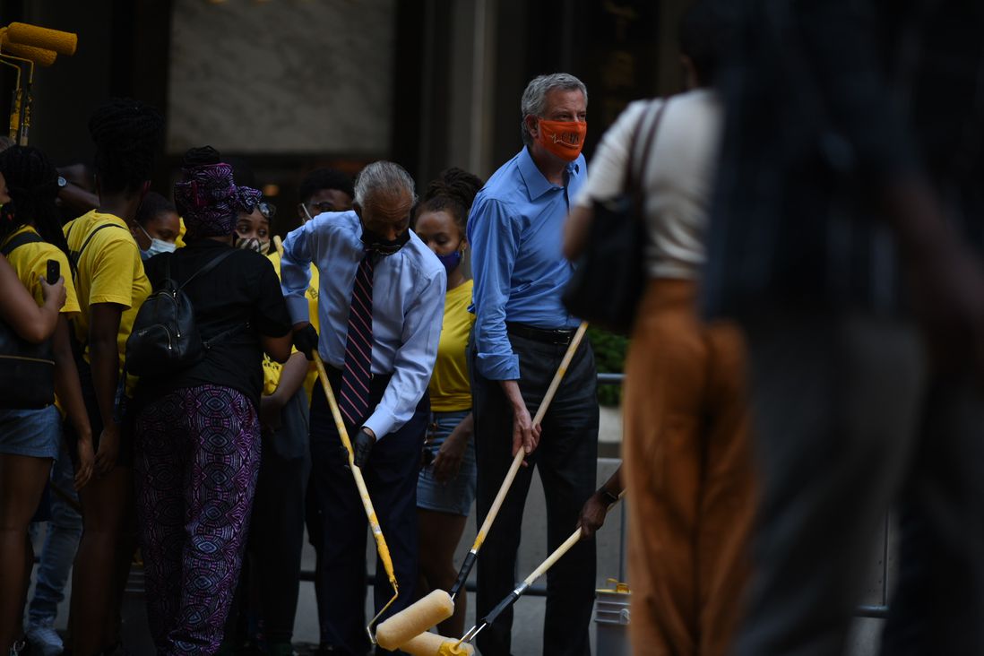 Photos of people painting Black Lives Matter in front of Trump Tower on June 9th, 2020